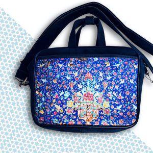 A stylish blue tile-patterned bag, perfect for carrying your essentials in classic fashion.