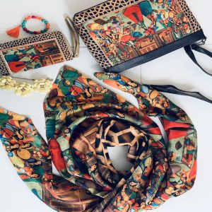 Bazm Collection featuring a scarf, shoulder bag, and envelope wallet in elegant design.